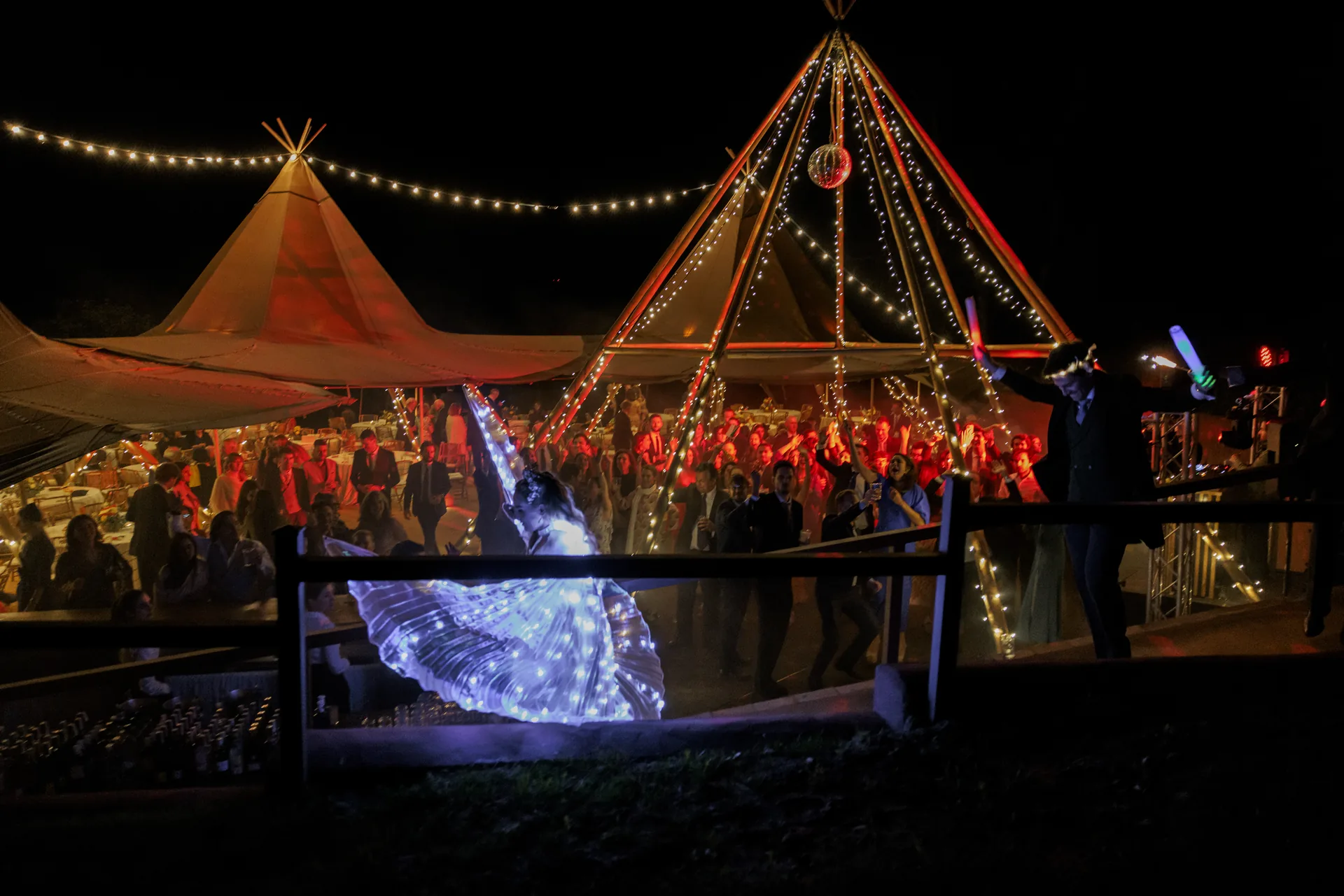Night celebration around the illuminated marquees