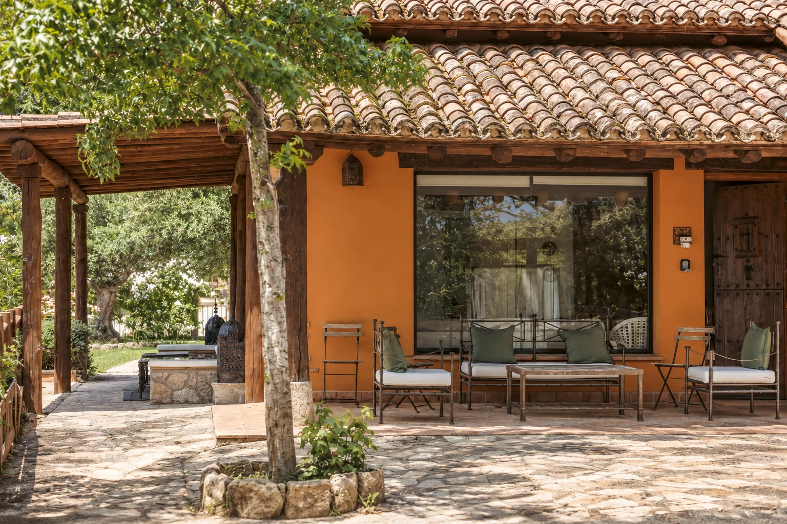 Porch at Villa Los Olivos beneath the holm oaks