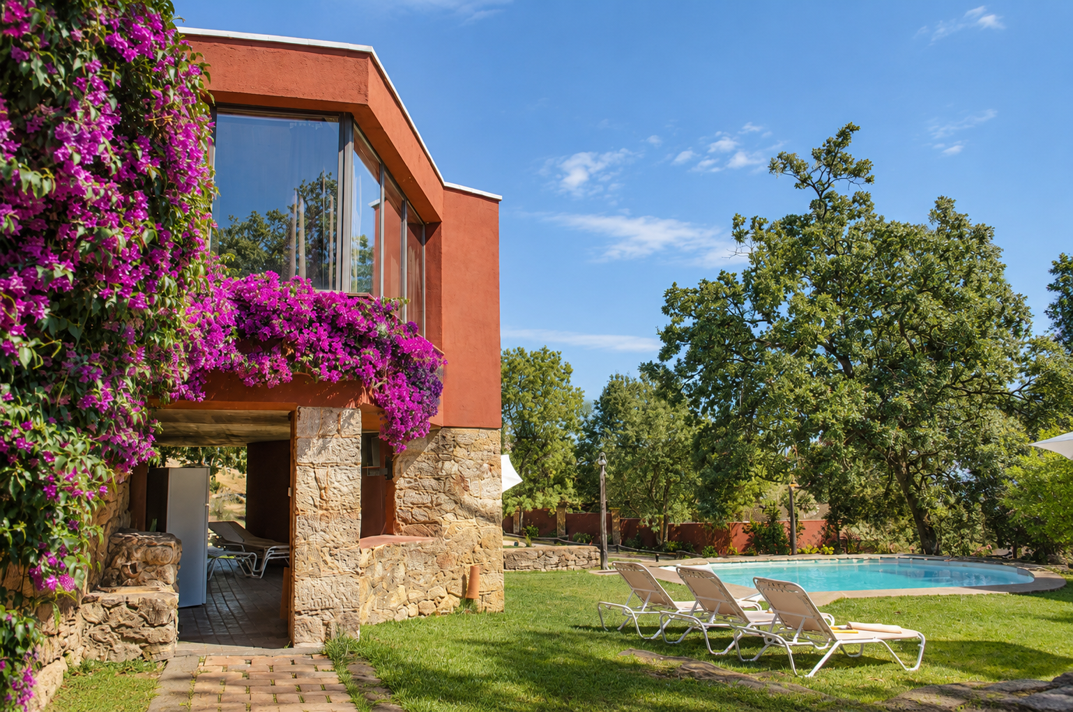 Pool and sun loungers at Villa Candelaria