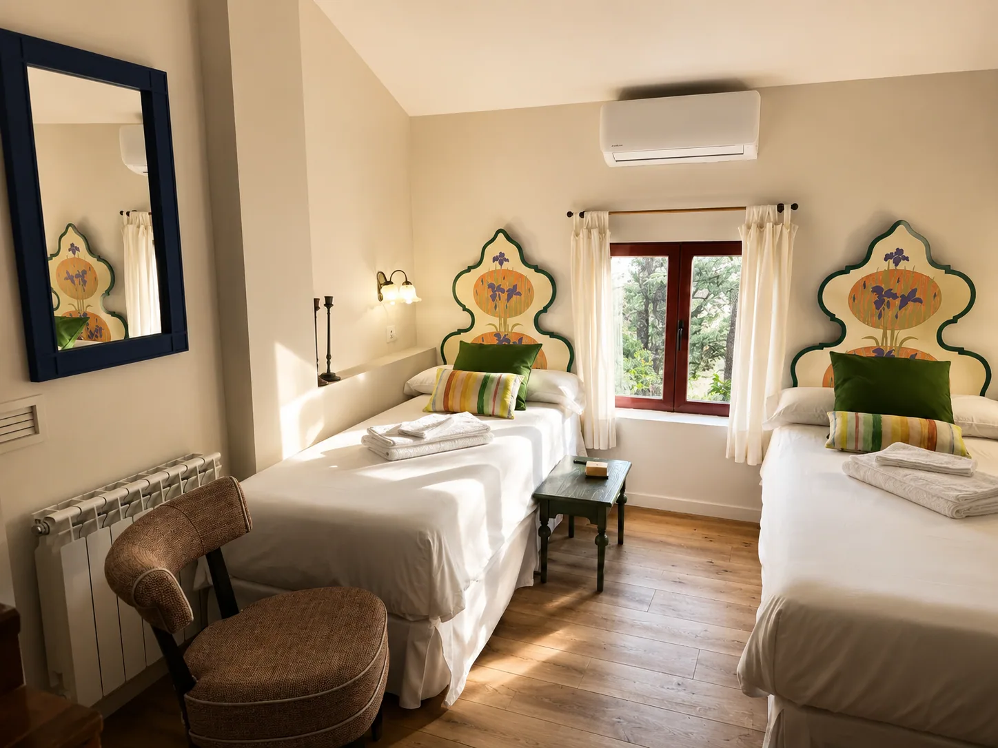 Bedroom of Villa Alardos with two single beds and painted headboards