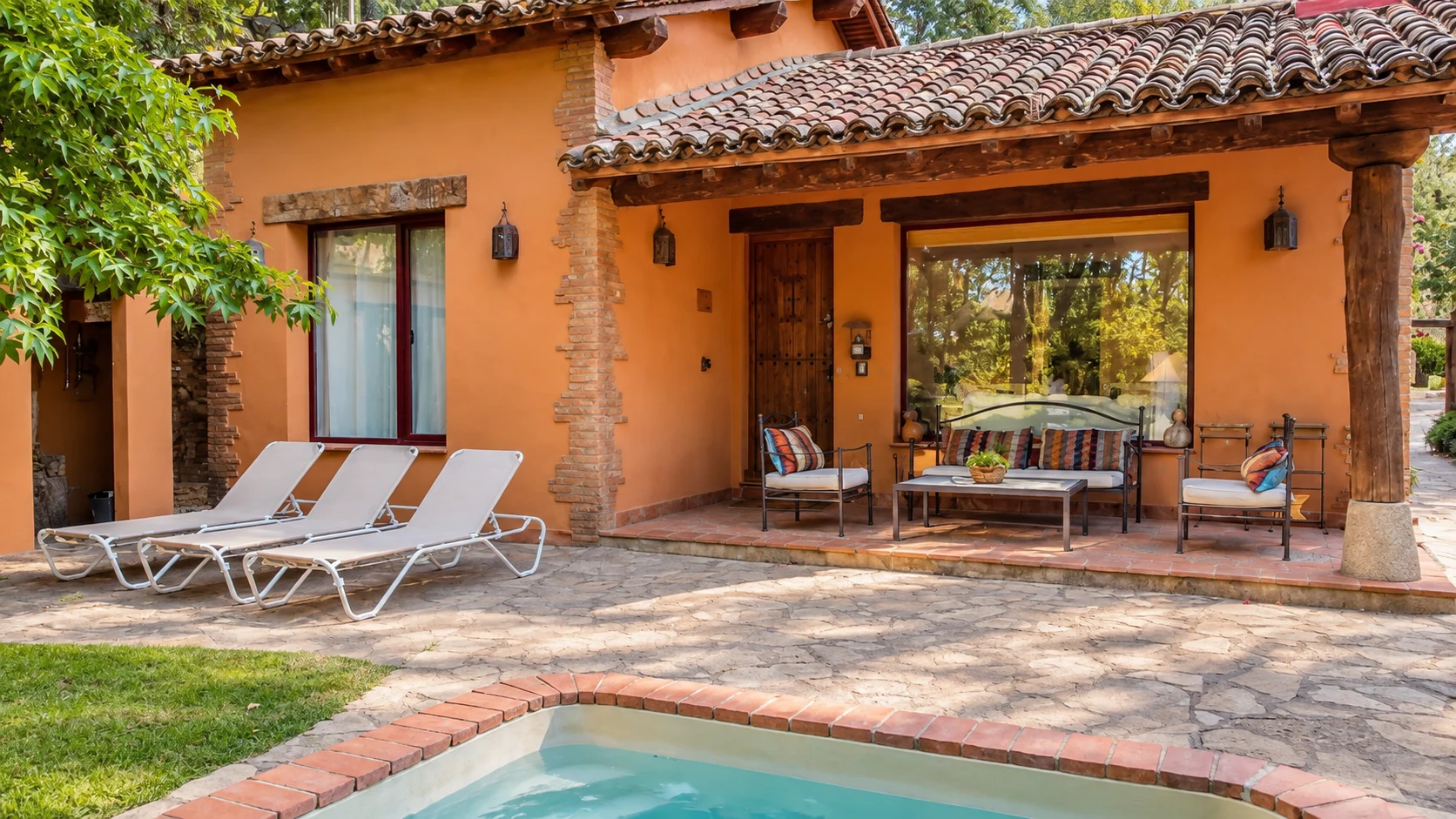 Facade, porch and pool at Villa Los Madroños