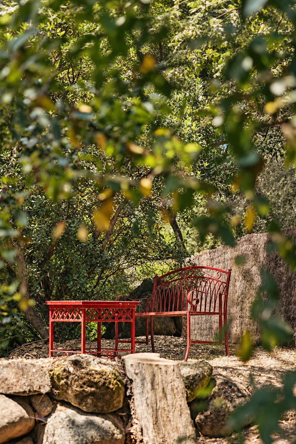 Red table among the trees at Villa Los Rosales
