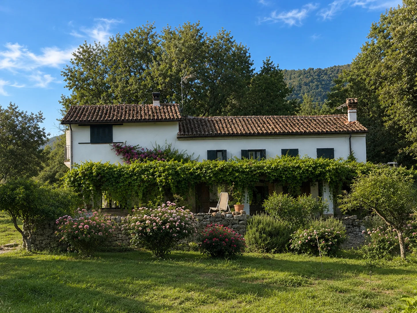Facade of Villa Alardos covered in vine