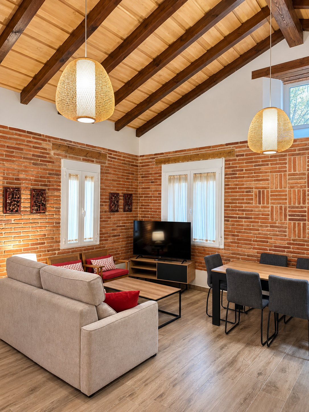 Living and dining room of Lavanda Apartment under the beamed ceiling
