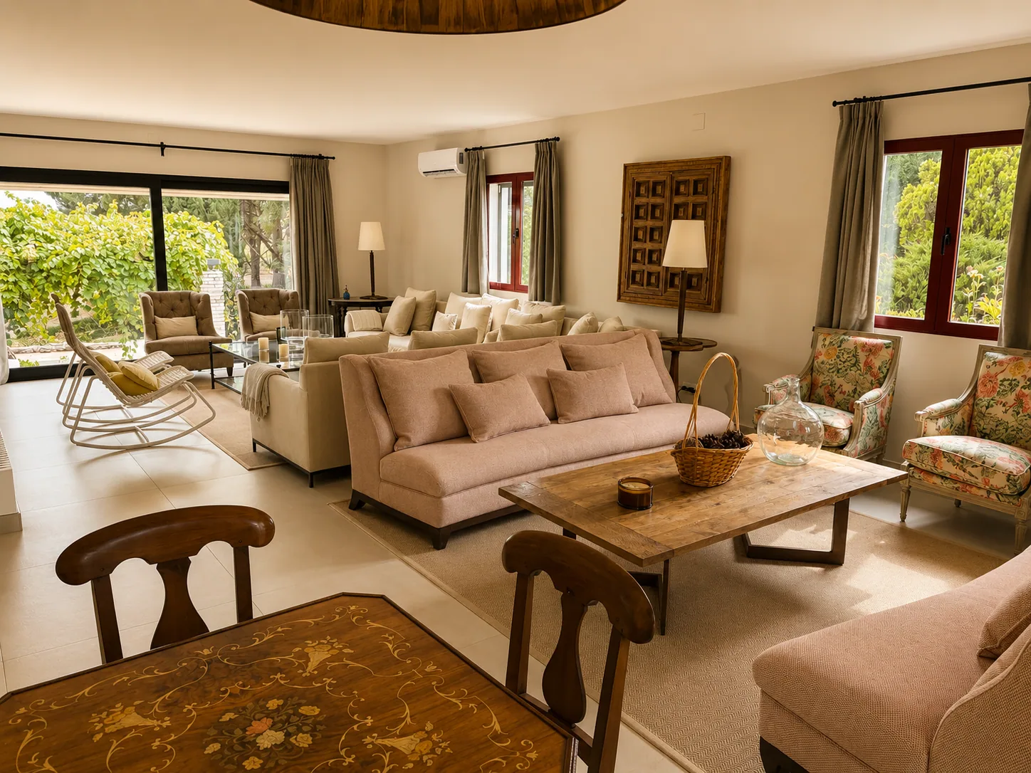 Living and dining room of Villa Alardos opening onto the garden