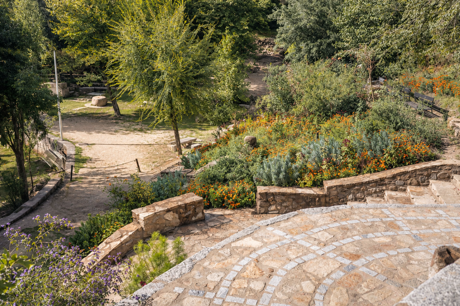 Stone terrace and gardens beside Romero Apartment