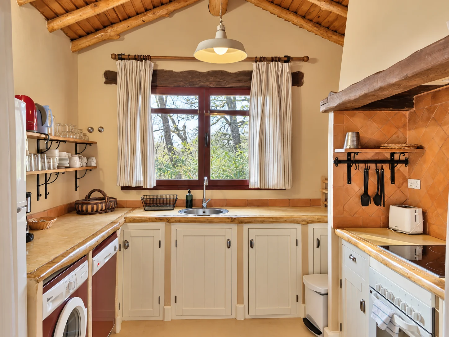 Kitchen at Villa Los Robles with a window onto the woods