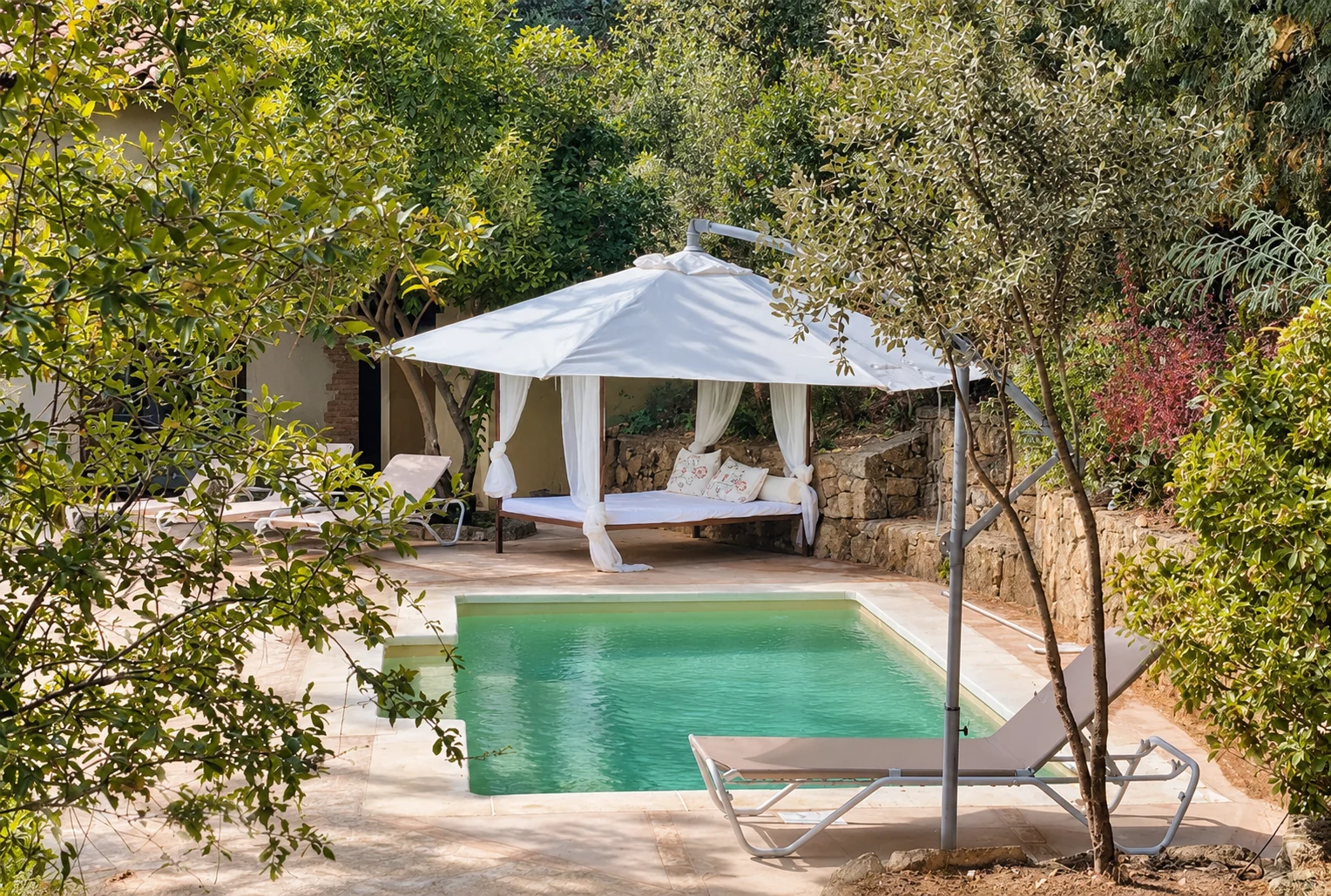 Pool and Balinese bed at Villa Los Naranjos