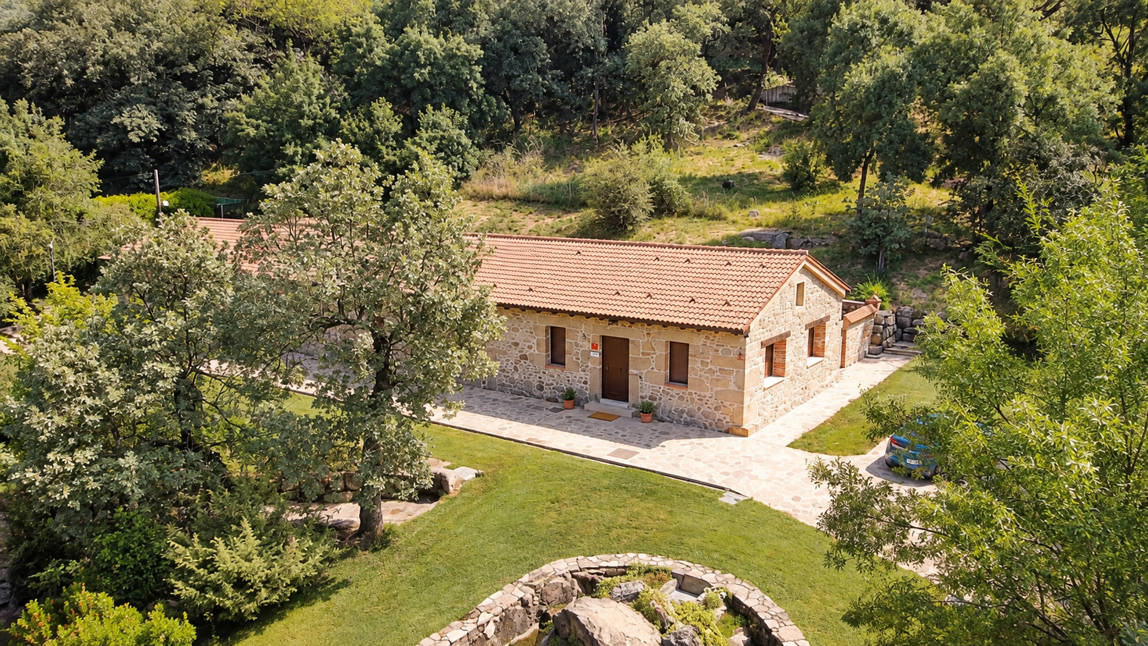 Close aerial view of Lavanda Apartment among the trees of Chilla