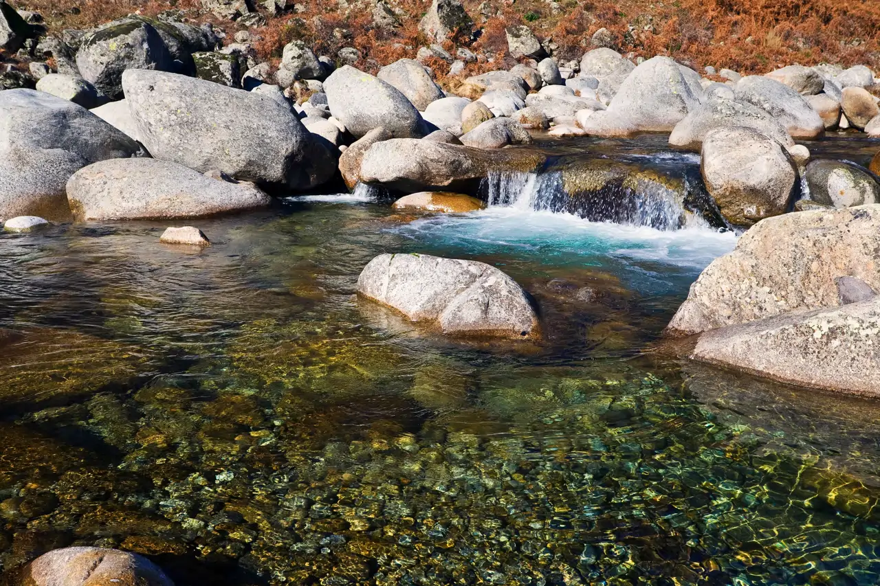 Clear water between rocks at the Garganta de Santa María in Candeleda