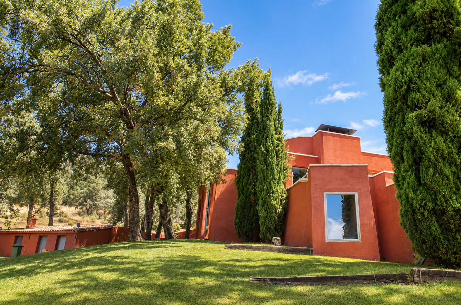 Facade of Villa Candelaria among trees