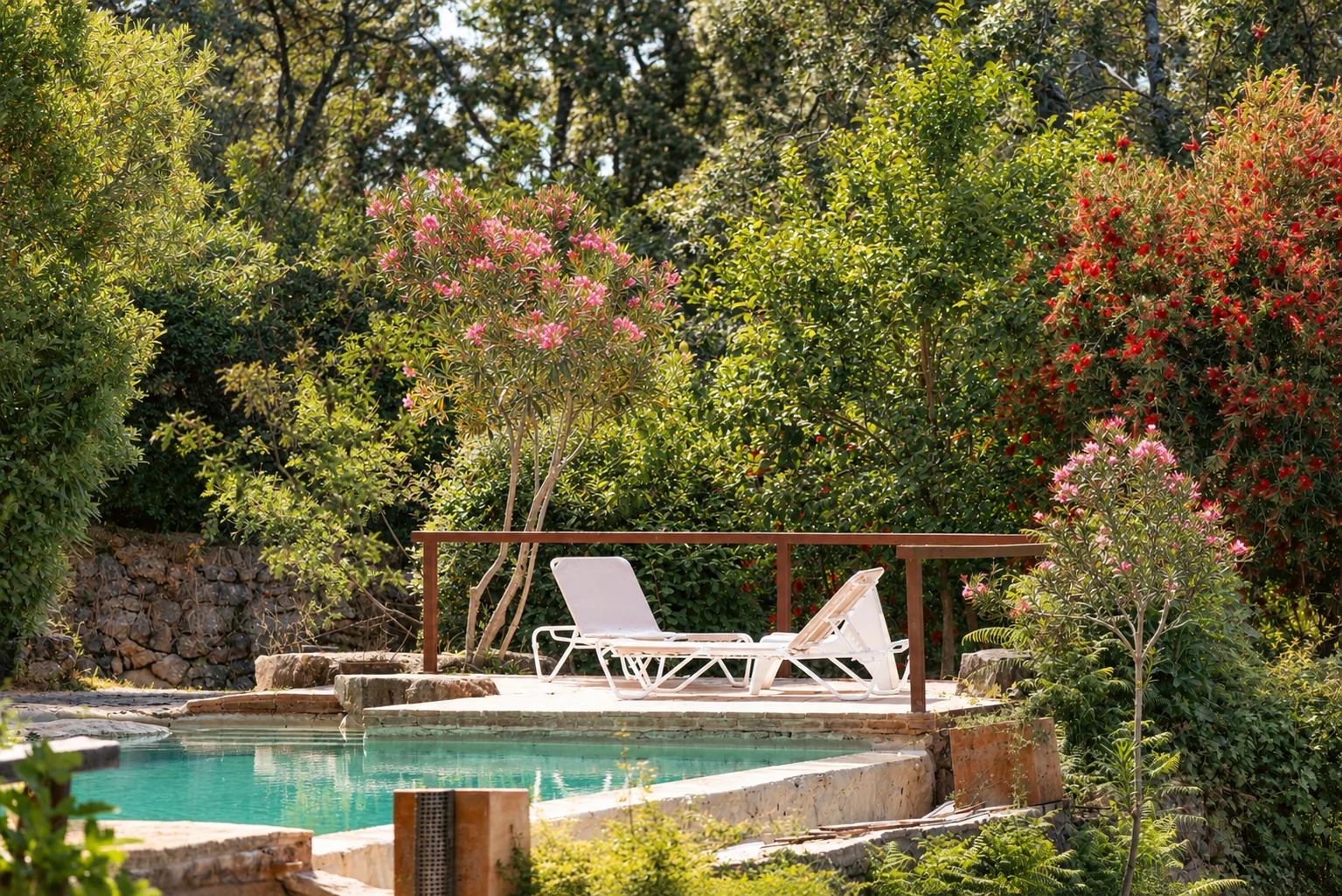 Pool and sun loungers at Villa El Arroyo