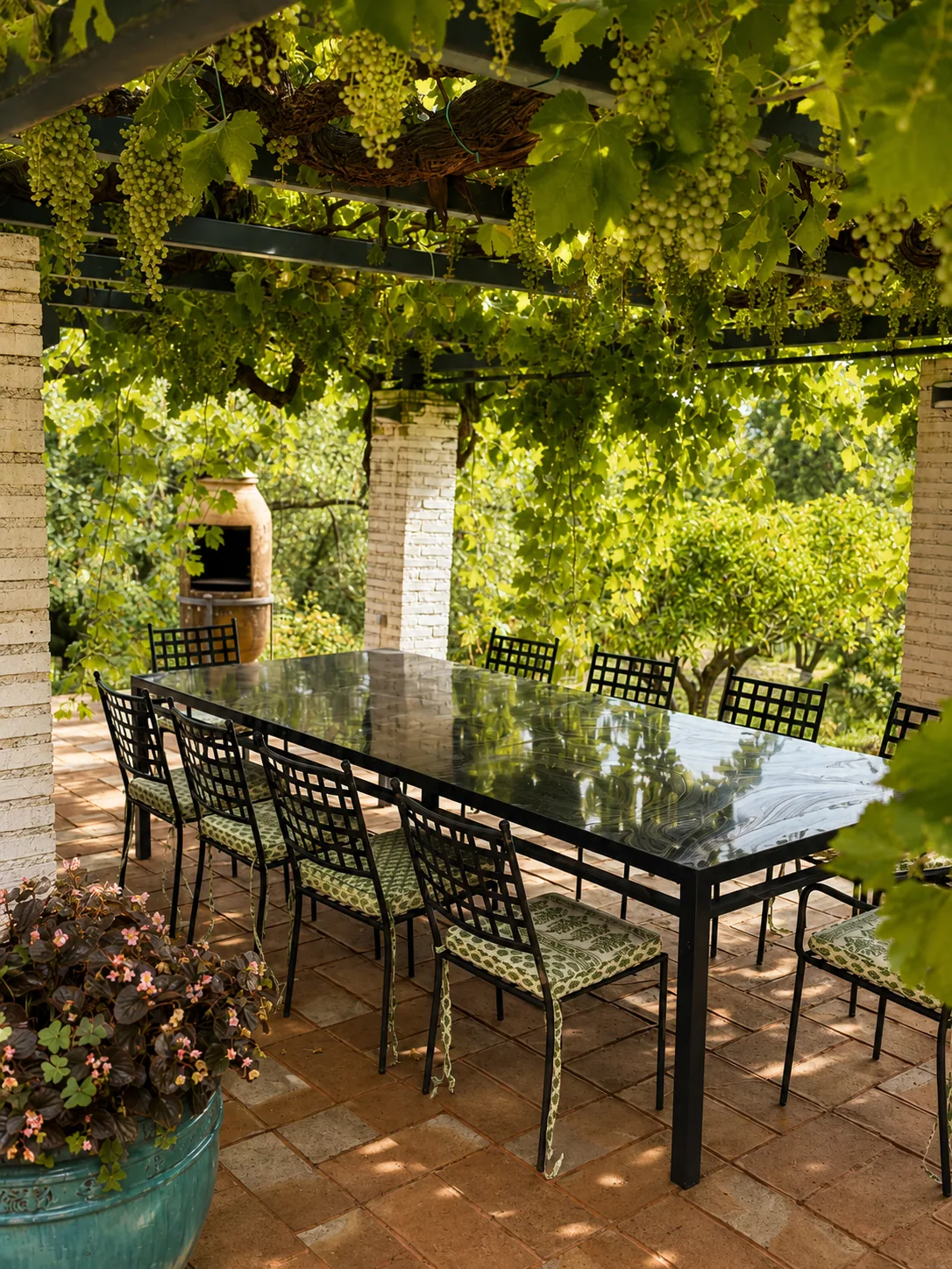 Long outdoor dining table at Villa Alardos under the vine