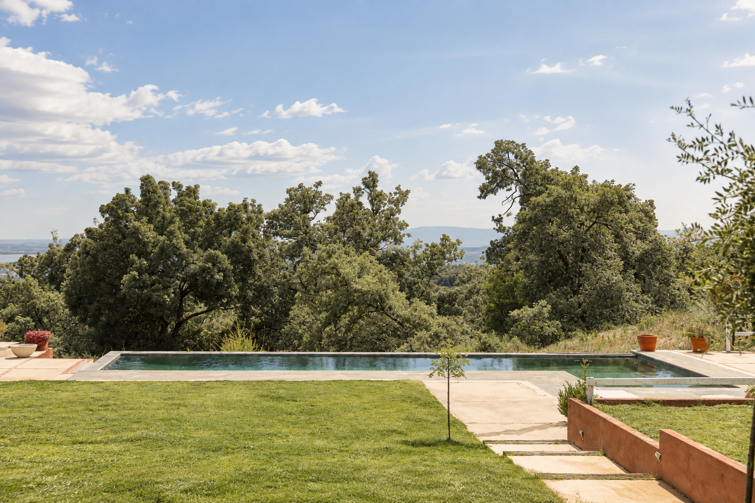 Pool and lawn at Villa Las Cuadras