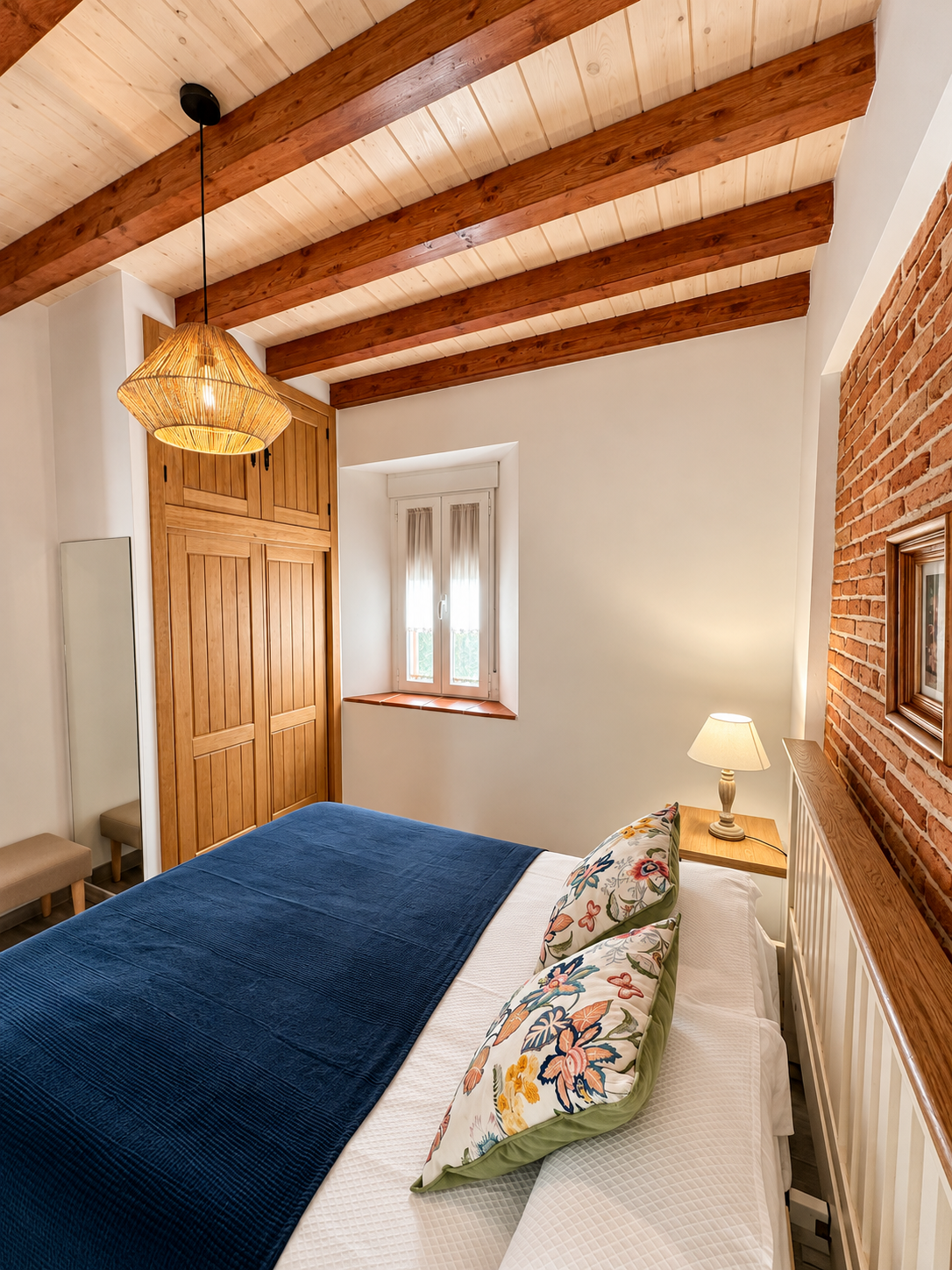 Bedroom of Romero Apartment with a wooden wardrobe