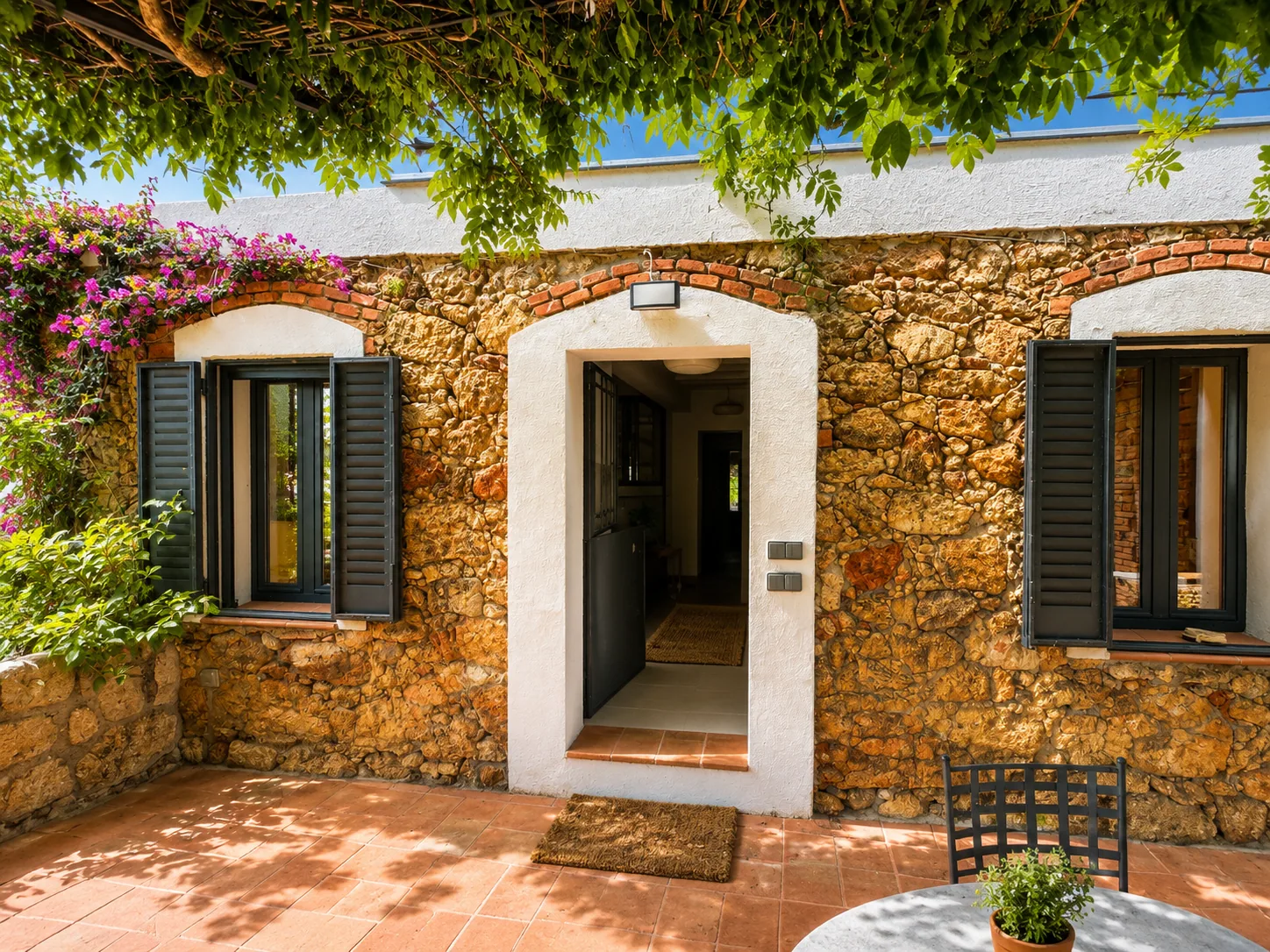 Stone porch leading into Villa Alardos