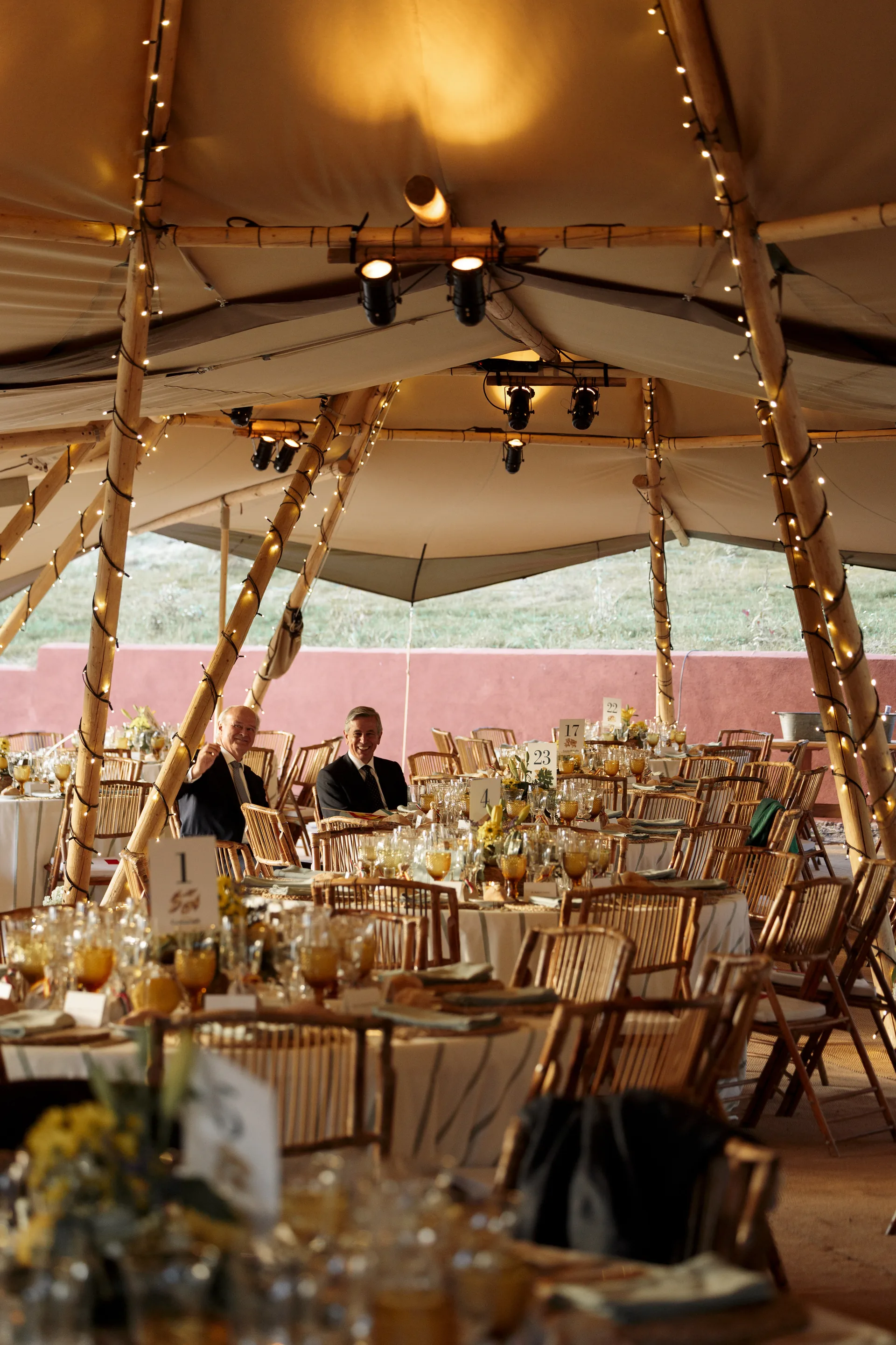 Vertical view inside the marquee with the tables set
