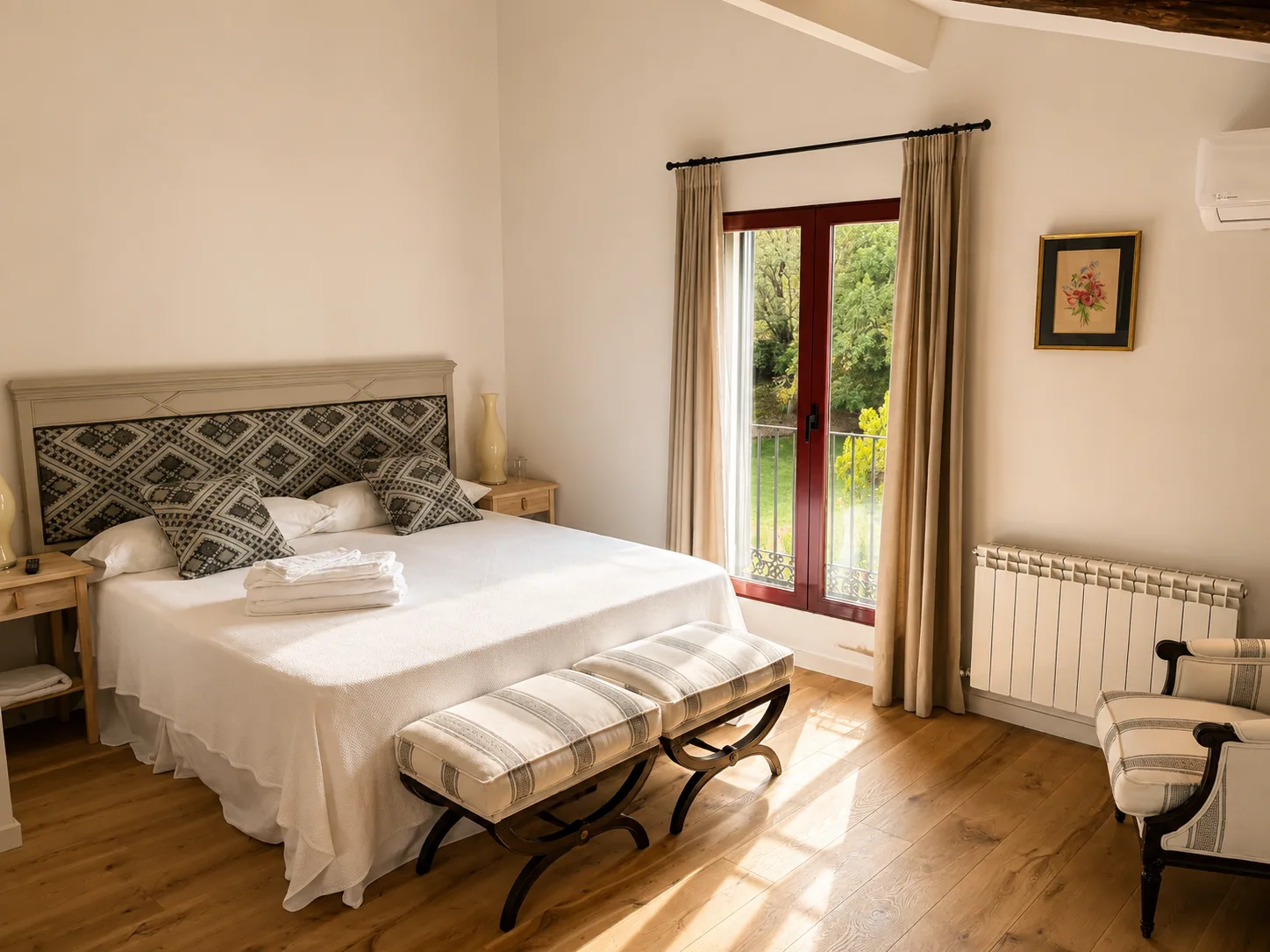 Bedroom of Villa Alardos with a king-size bed and access to the garden