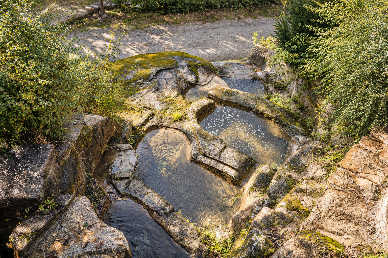 Mountain stream among rocks near Romero Apartment