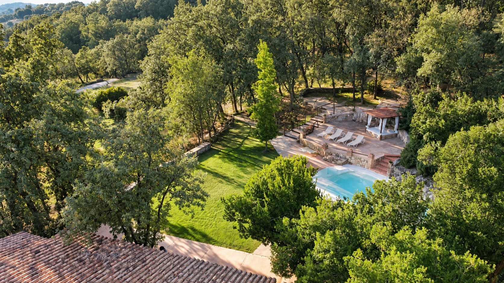 Elevated view of the pool and garden at Villa El Bosque