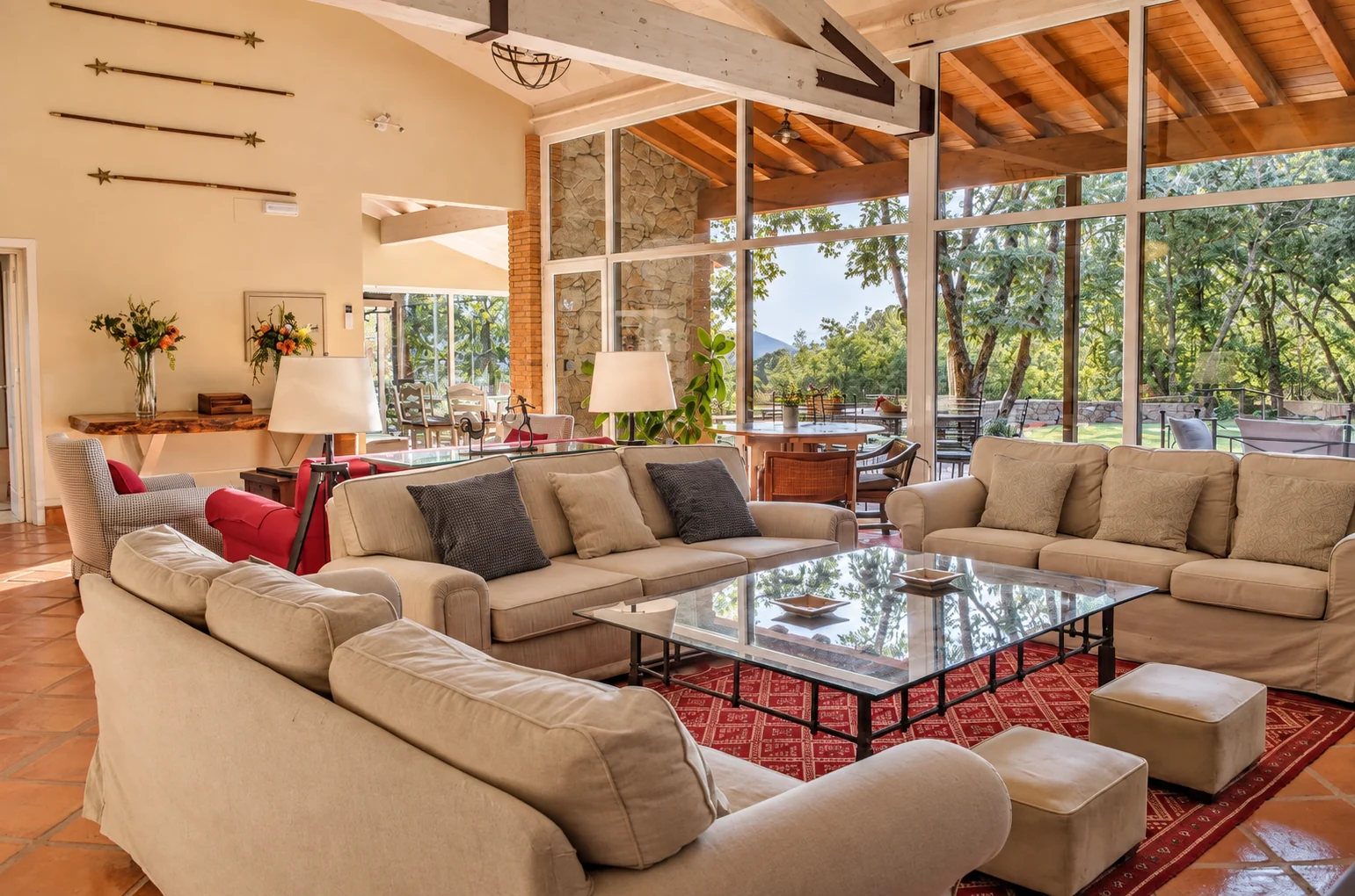Living room at Villa El Bosque with windows onto the garden