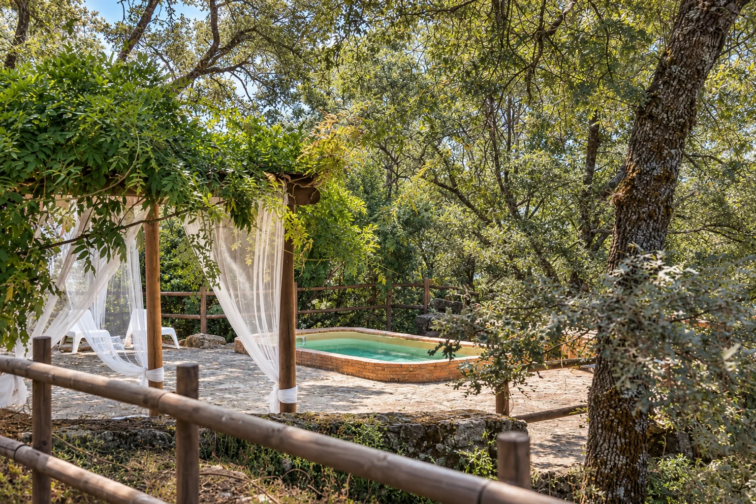 Pool and pergola at Villa Los Robles among the trees