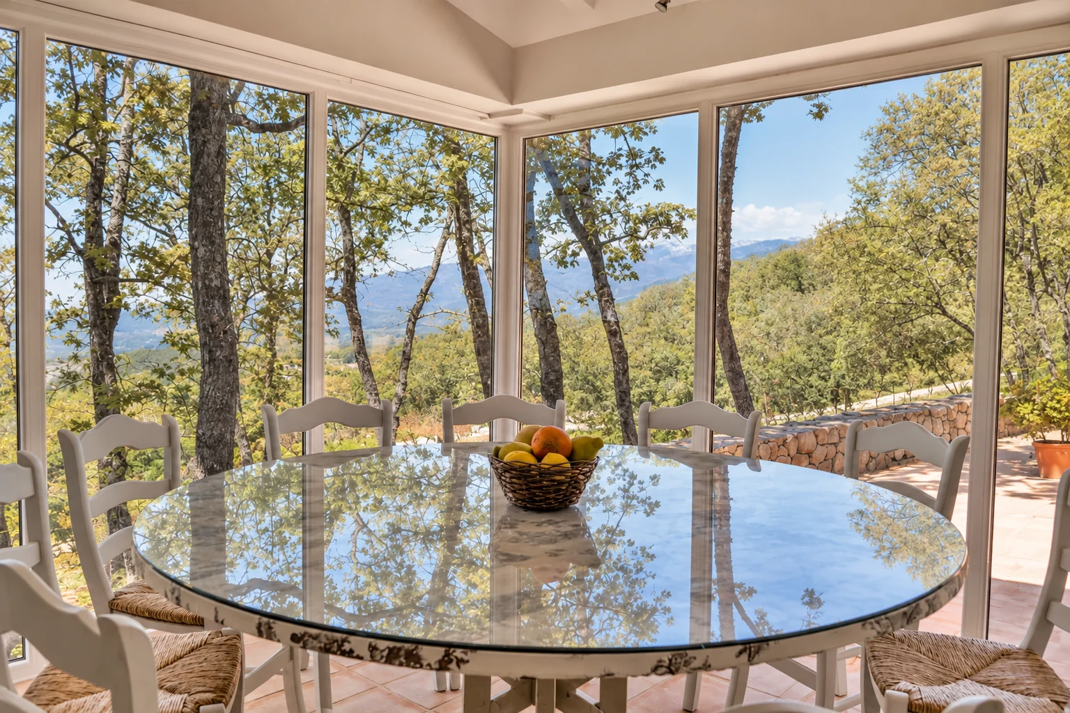 Glazed dining room at Villa El Bosque overlooking the mountains