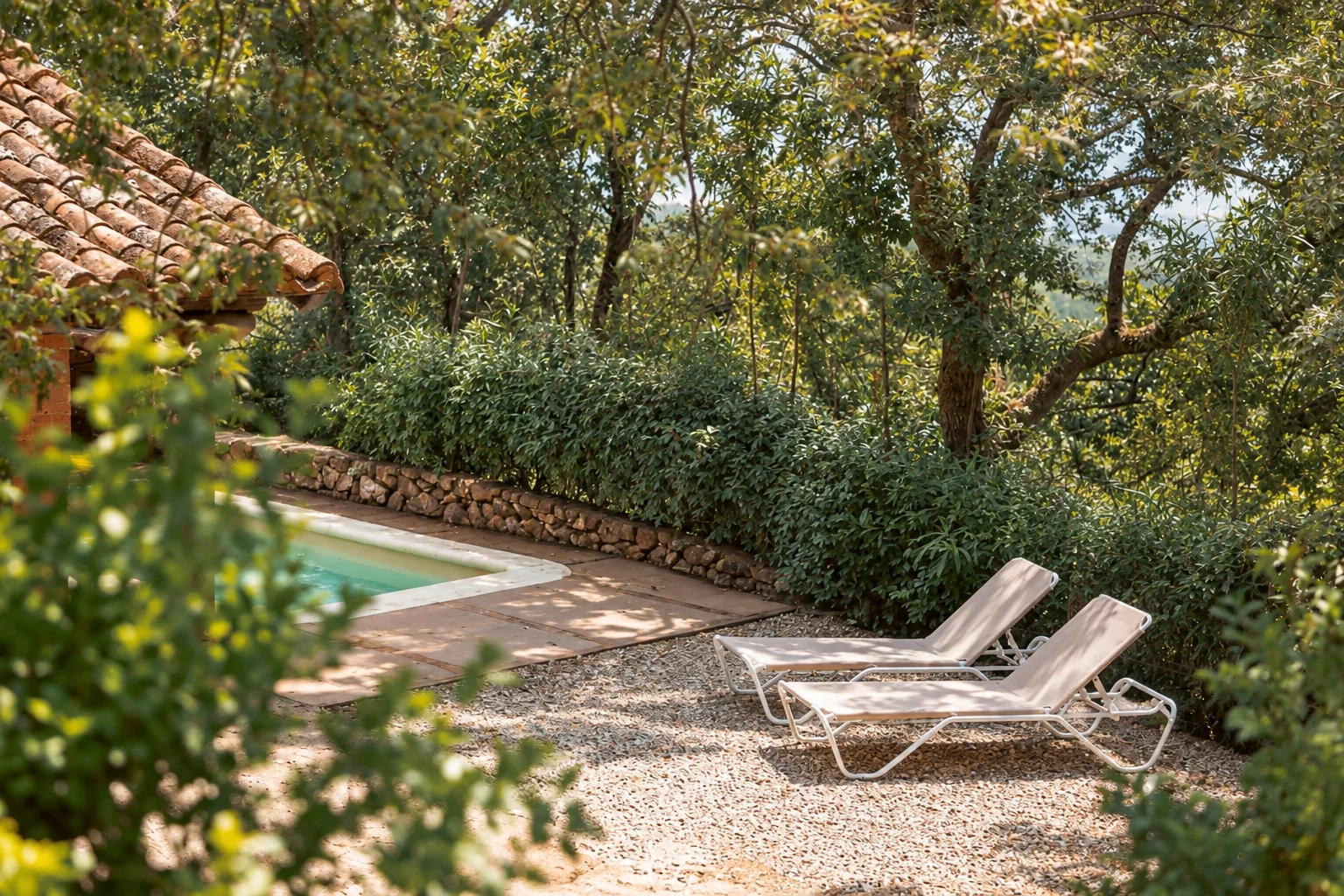 Sun loungers beside the private pool at Villa Los Rosales