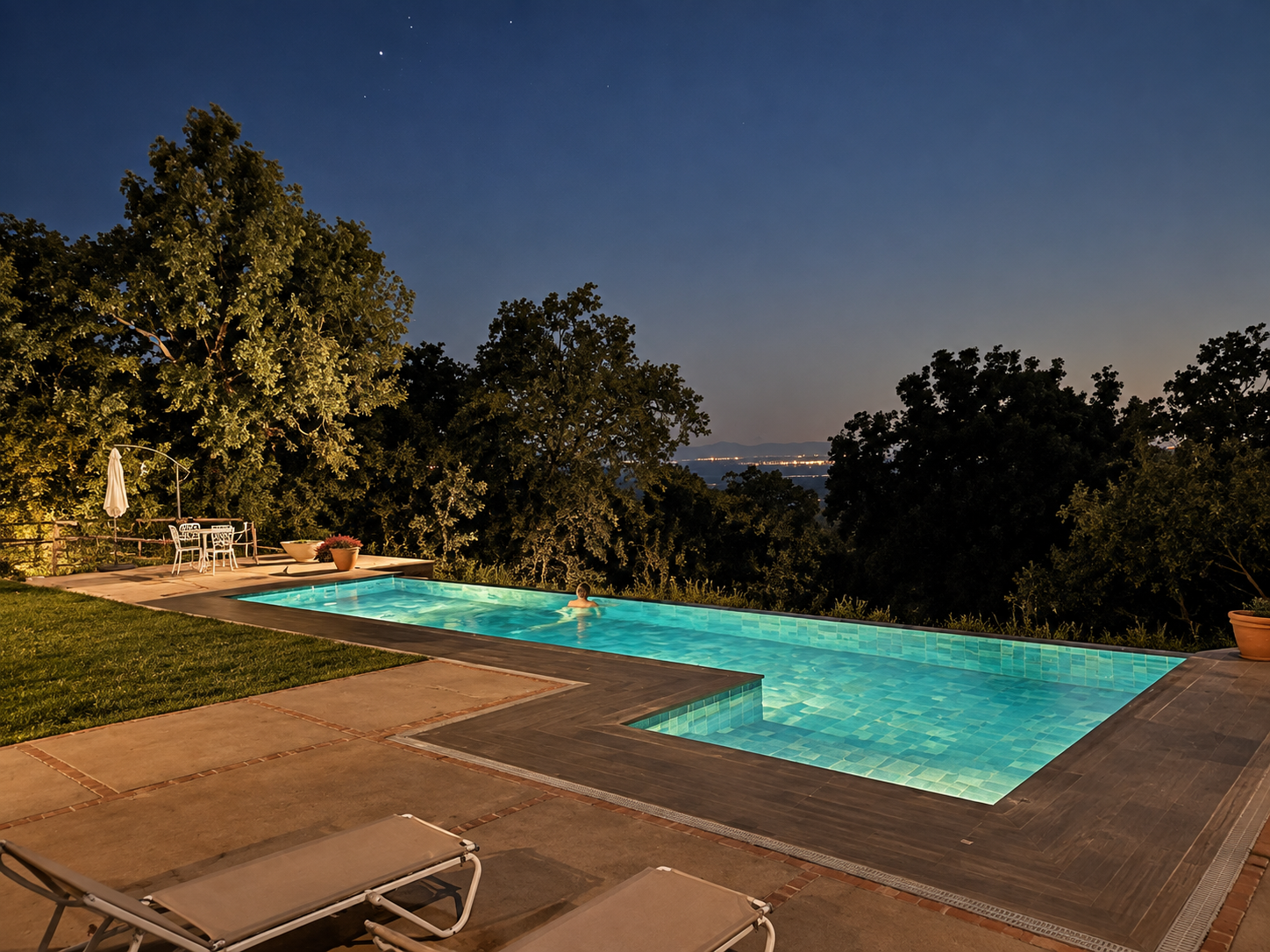 Illuminated pool at Villa Las Cuadras at dusk