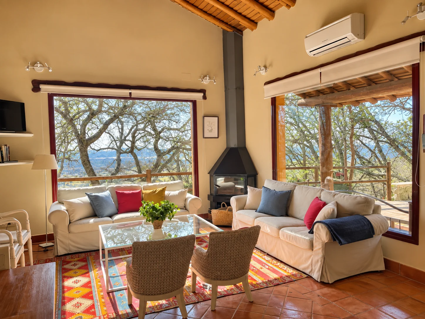 Living room at Villa Los Madroños opening onto the oak grove