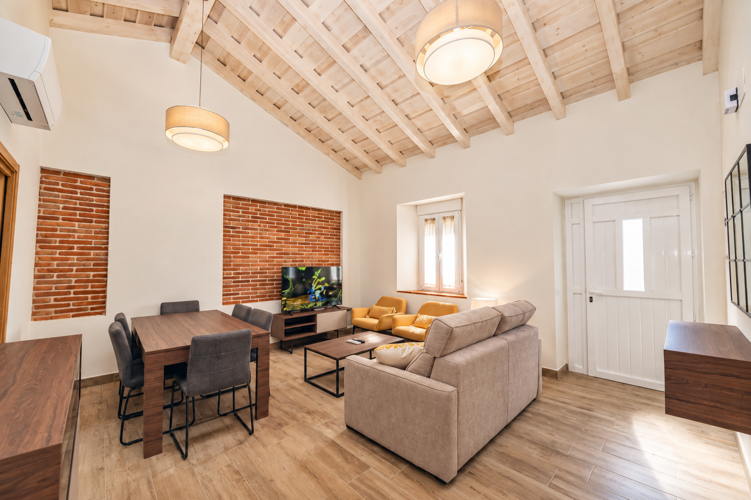 Living room of Tomillo Apartment with sofa and dining table