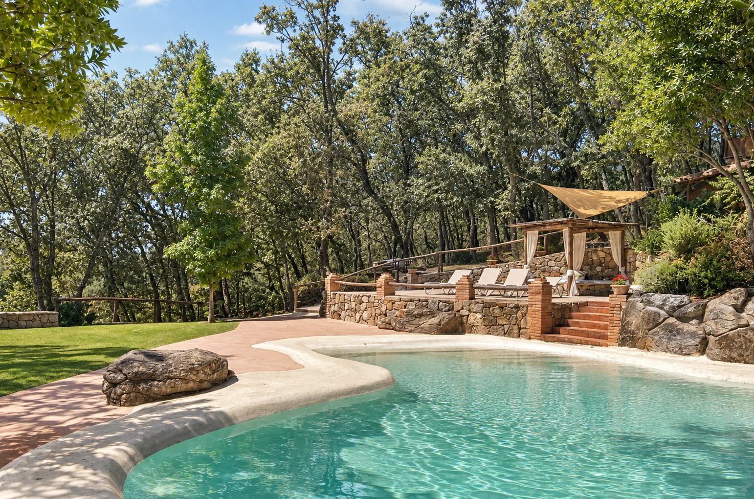 Pool at Villa El Bosque beneath a large oak