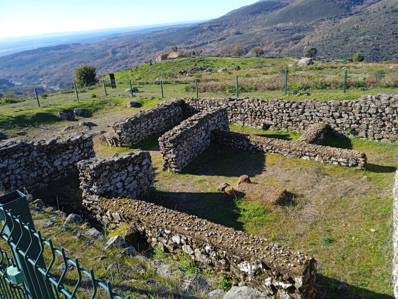 Remains of dwellings at the Castro Vetón de El Raso with Gredos in the background