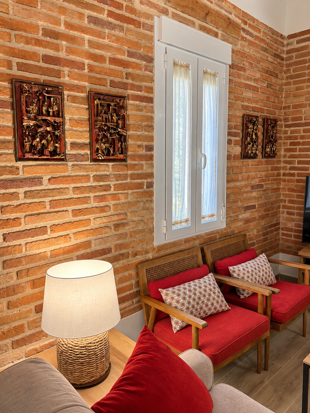 Sitting area of Lavanda Apartment beside the brick wall