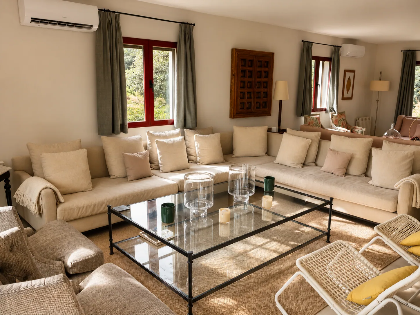 Living room of Villa Alardos with sofas and windows onto the garden