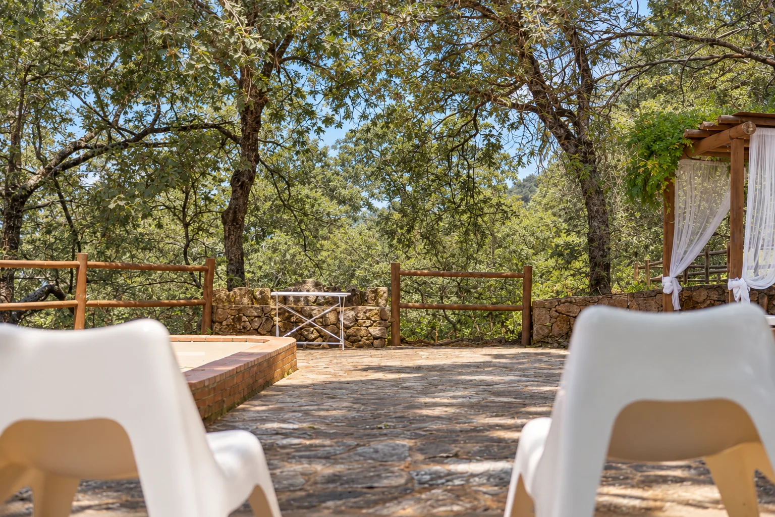 Terrace at Villa Los Robles beneath the oak trees