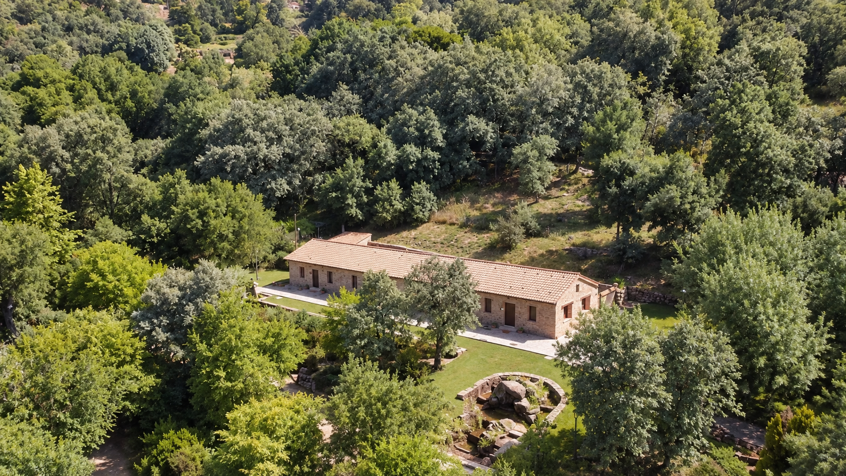 Aerial view of Lavanda Apartment and its wooded surroundings