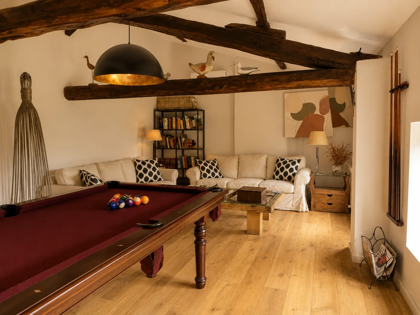 Billiard room of Villa Alardos with wooden beams