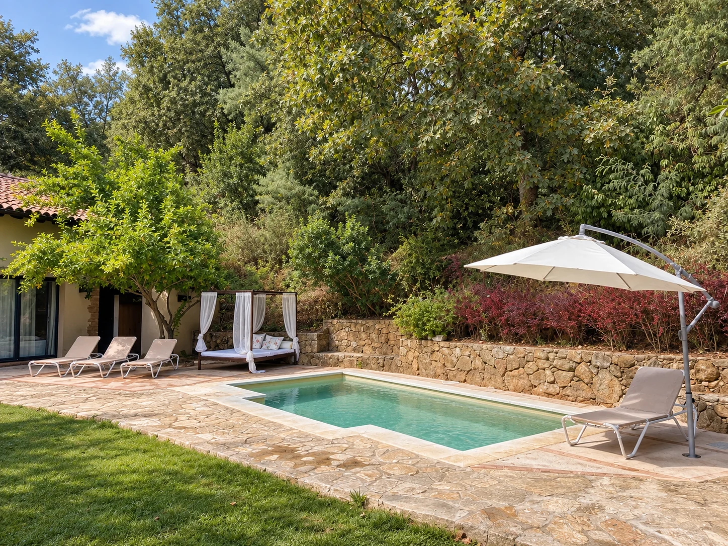 Pool at Villa Los Naranjos surrounded by woodland