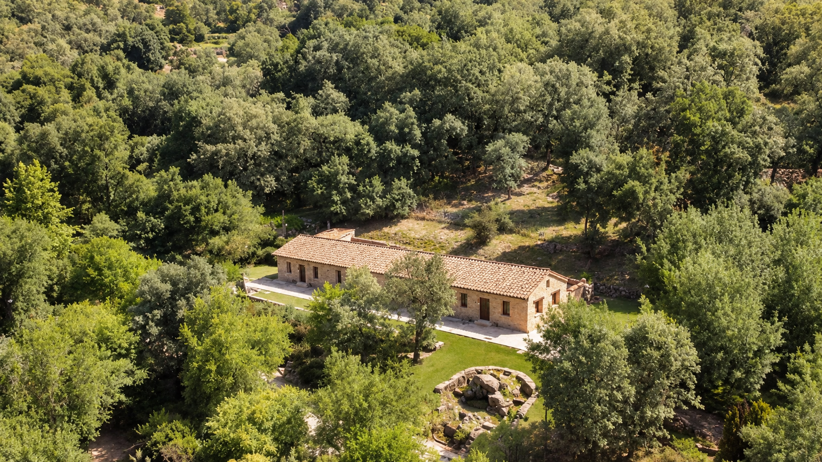 Elevated view of Romero Apartment among the trees