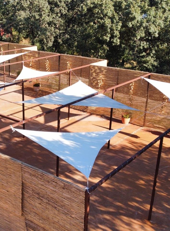 Outdoor area with shade sails set up for an event